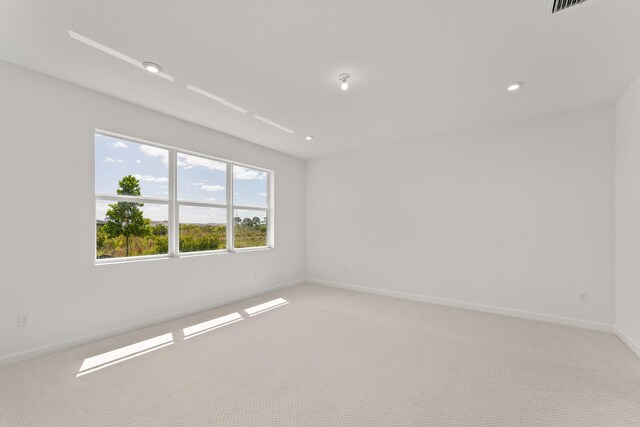 13461 SW Bally Dr, Port Saint Lucie, FL 34987 - spare room with light colored carpet and baseboards