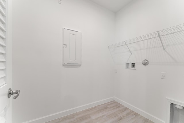 13445 SW Bally Dr, Port Saint Lucie, FL 34987 - washroom featuring electric dryer hookup, light wood finished floors, gas dryer hookup, hookup for a washing machine, and baseboards