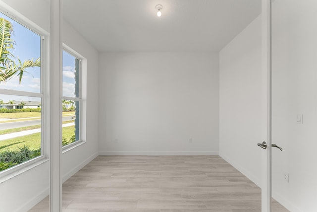 13445 SW Bally Dr, Port Saint Lucie, FL 34987 - unfurnished room featuring light wood-style floors and baseboards