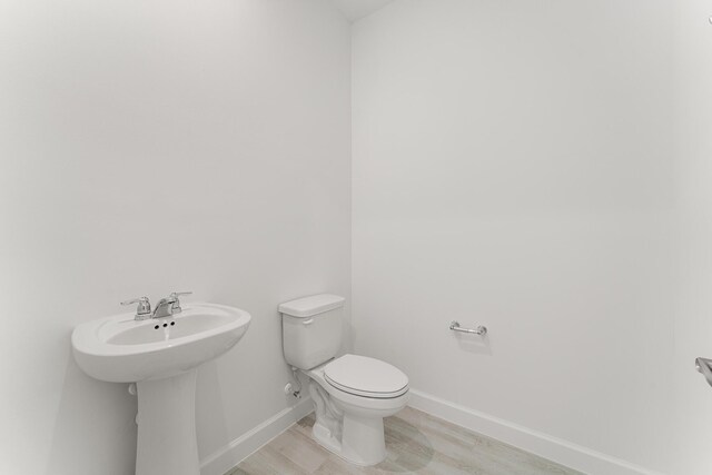13445 SW Bally Dr, Port Saint Lucie, FL 34987 - half bathroom with toilet and baseboards