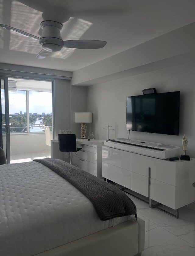 215 N Birch Rd Unit 8C, Fort Lauderdale, FL 33304 - bedroom with light marble finish floors and ceiling fan
