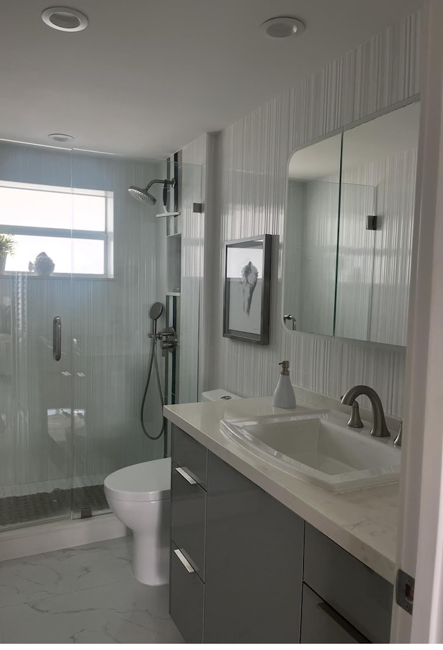 215 N Birch Rd Unit 8C, Fort Lauderdale, FL 33304 - full bathroom with a shower stall, toilet, vanity, and marble look tile flooring