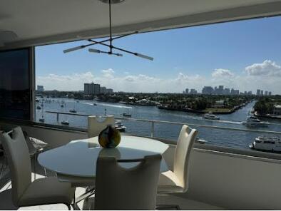 215 N Birch Rd Unit 8C, Fort Lauderdale, FL 33304 - balcony with a skyline view and a water view
