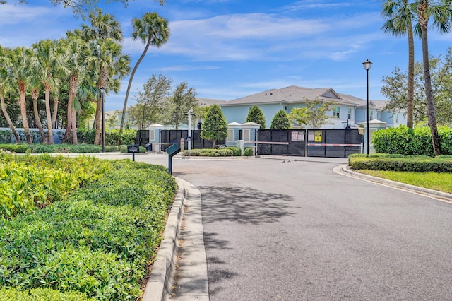 1842 Sandpiper Pointe Pl, Deerfield Beach, FL 33442 - view of asphalt street featuring street lighting, curbs, a gate, and a gated entry