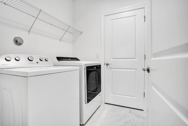 1842 Sandpiper Pointe Pl, Deerfield Beach, FL 33442 - clothes washing area featuring light marble finish flooring and washer and clothes dryer