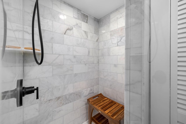 full bath featuring a tile shower