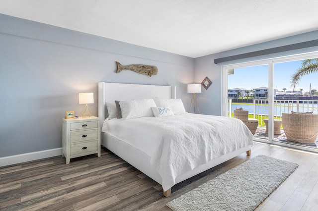 1536 SE 15th Ct Unit 107, Deerfield Beach, FL 33441 - bedroom featuring access to outside, dark wood-style floors, a water view, and baseboards