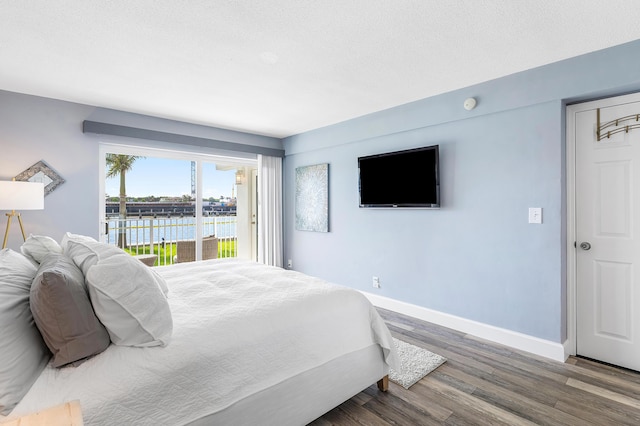 1536 SE 15th Ct Unit 107, Deerfield Beach, FL 33441 - bedroom with wood finished floors, access to outside, and baseboards