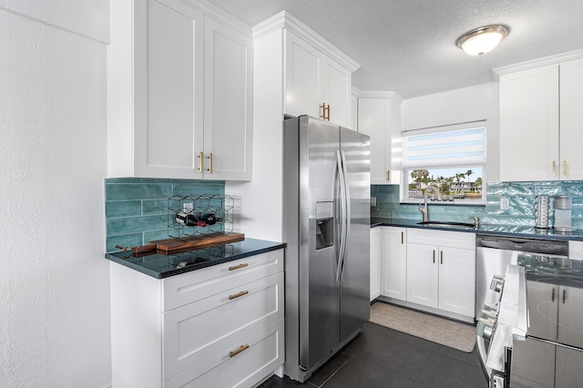 1536 SE 15th Ct Unit 107, Deerfield Beach, FL 33441 - kitchen with stainless steel refrigerator with ice dispenser, a sink, decorative backsplash, stove, and a textured ceiling