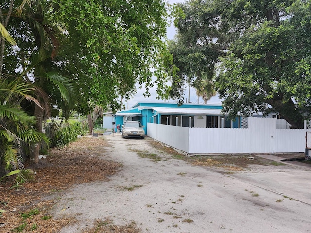 119 S Price St S, Lake Worth, FL 33461 - view of front of home with driveway and fence