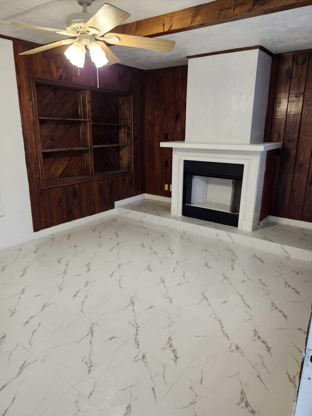 119 S Price St S, Lake Worth, FL 33461 - unfurnished living room with wooden walls, a glass covered fireplace, a ceiling fan, and marble finish floors