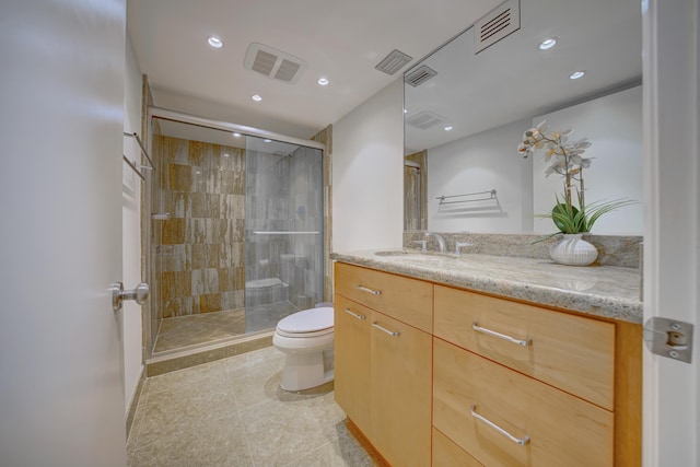 1865 Brickell Ave Unit A611, Miami, FL 33129 - bathroom with toilet, a shower stall, vanity, recessed lighting, and tile patterned floors