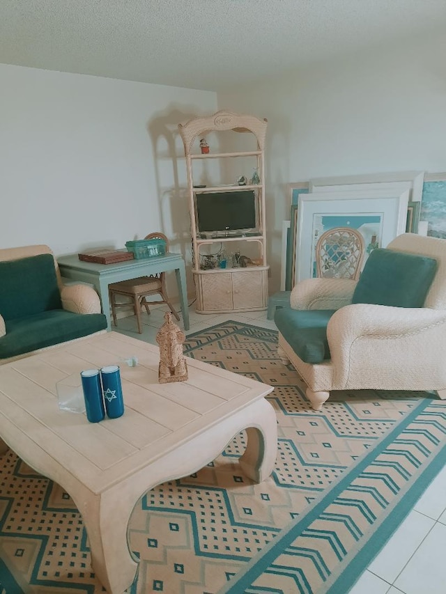 15109 Ashland Dr Unit 307, Delray Beach, FL 33484 - living area featuring tile patterned flooring and a textured ceiling