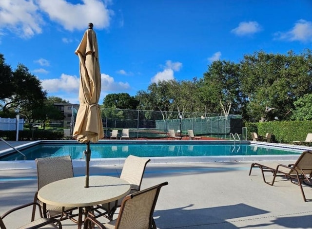 15109 Ashland Dr Unit 307, Delray Beach, FL 33484 - community pool with fence and a patio area