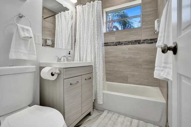 bathroom with toilet, vanity, and shower / tub combo with curtain