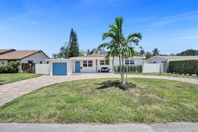 single story home featuring decorative driveway, a garage, and stucco siding
