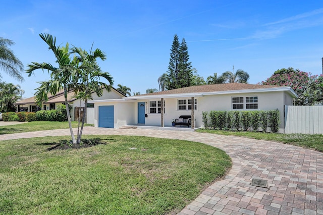 single story home with curved driveway, stucco siding, and an attached garage