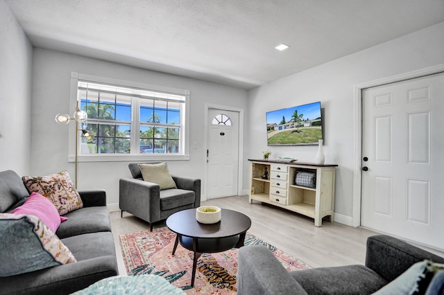 living area featuring wood finished floors and baseboards