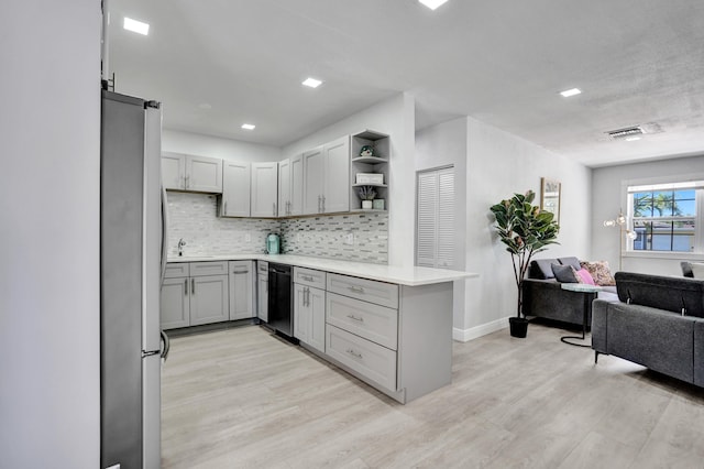 kitchen with freestanding refrigerator, black dishwasher, open floor plan, gray cabinets, and open shelves