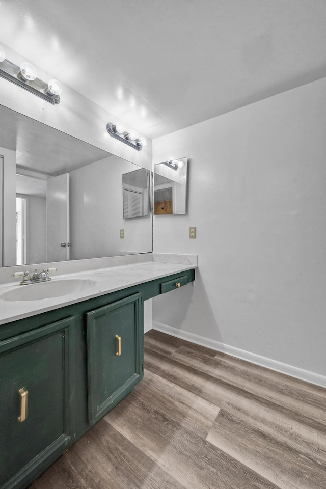 2660 Albatross Rd N Unit 6-C, Delray Beach, FL 33444 - bathroom with wood finished floors, vanity, and baseboards