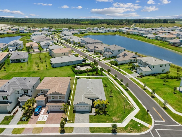 aerial perspective of suburban area with a nearby body of water