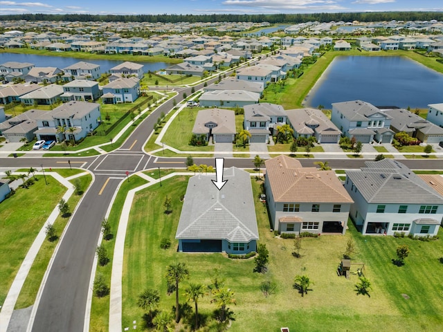 aerial perspective of suburban area featuring a nearby body of water