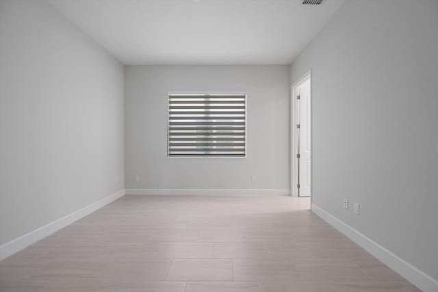 empty room with baseboards