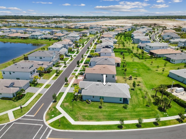 aerial perspective of suburban area featuring a nearby body of water