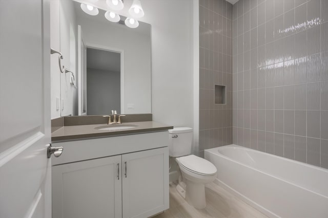 bathroom with vanity, toilet, and shower / bathtub combination
