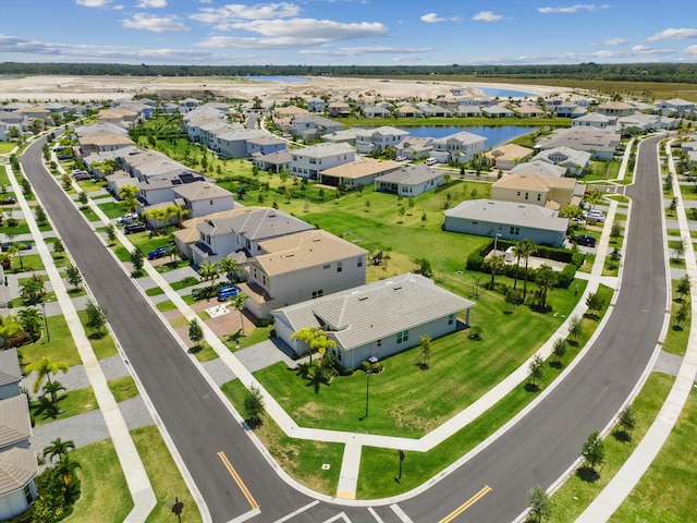 aerial view of residential area with a nearby body of water