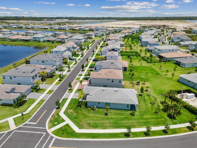 aerial perspective of suburban area featuring a large body of water