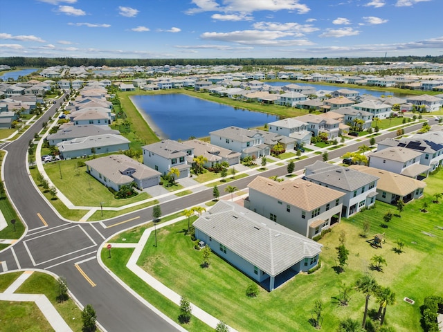 aerial view of residential area with a large body of water