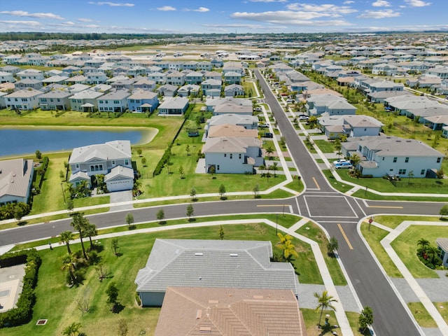 aerial perspective of suburban area featuring a large body of water