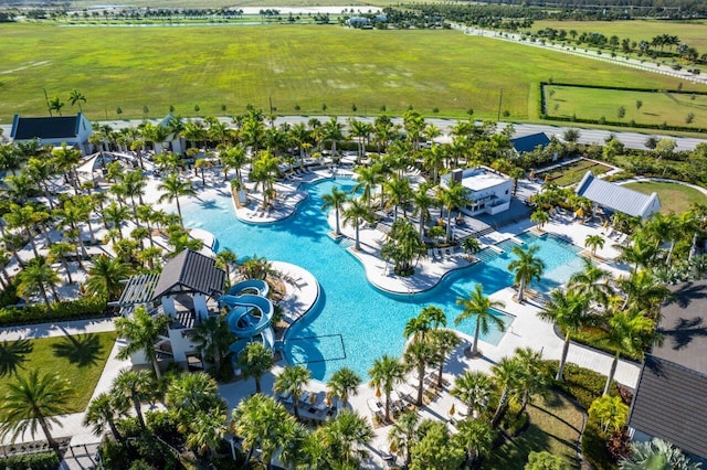 aerial view of sparsely populated area featuring a pool