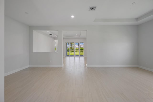 empty room with baseboards and recessed lighting
