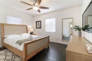 103 SE 5th Ave, Boynton Beach, FL 33435 - bedroom with baseboards, dark wood-type flooring, and ceiling fan