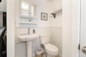 103 SE 5th Ave, Boynton Beach, FL 33435 - bathroom featuring toilet and wainscoting