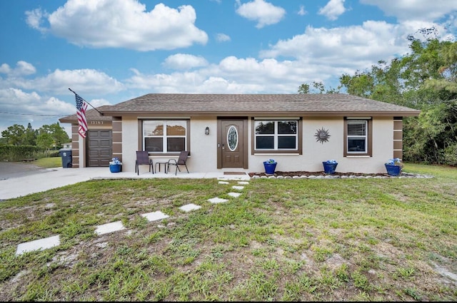 13167 75th Ln N, The Acreage, FL 33412 - single story home featuring stucco siding, a front yard, driveway, and an attached garage