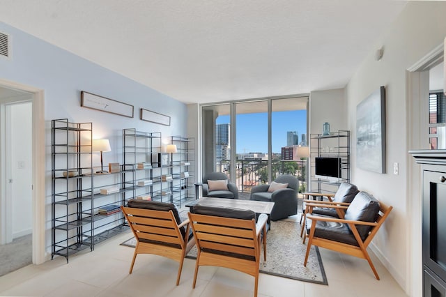 480 Hibiscus St Unit 709, West Palm Beach, FL 33401 - living area with expansive windows and tile patterned floors