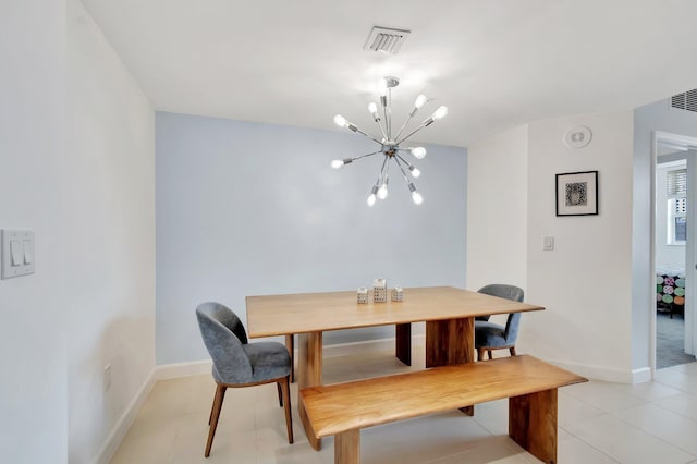 480 Hibiscus St Unit 709, West Palm Beach, FL 33401 - dining area featuring a chandelier, baseboards, and light tile patterned flooring