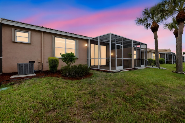 8623 Mangrove Cay, West Palm Beach, FL 33411 - back of property featuring central air condition unit, stucco siding, a lawn, and a tiled roof