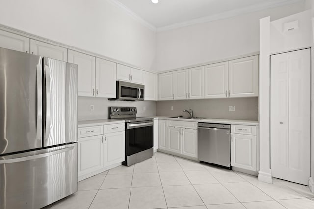 8623 Mangrove Cay, West Palm Beach, FL 33411 - kitchen featuring stainless steel appliances, a sink, light countertops, crown molding, and light tile patterned floors
