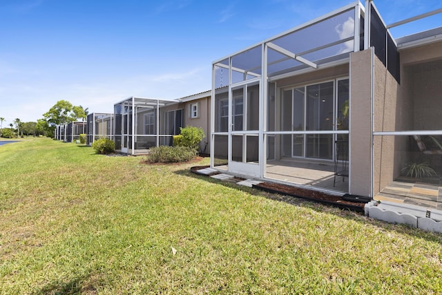 8623 Mangrove Cay, West Palm Beach, FL 33411 - view of green lawn with a lanai