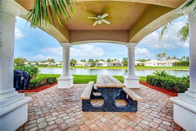 8623 Mangrove Cay, West Palm Beach, FL 33411 - view of patio / terrace featuring ceiling fan, a water view, and outdoor dining area