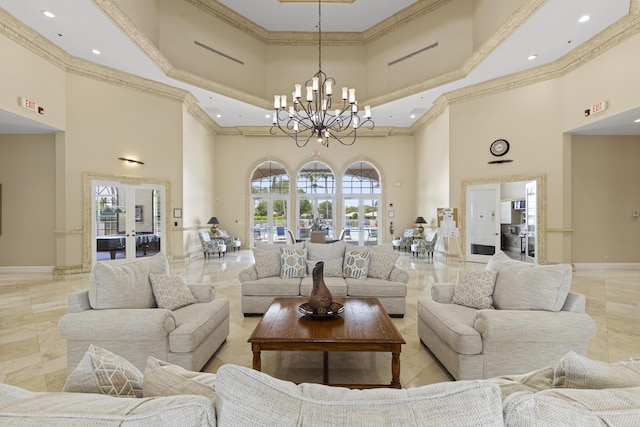 8623 Mangrove Cay, West Palm Beach, FL 33411 - living area with a high ceiling, ornamental molding, baseboards, a chandelier, and recessed lighting