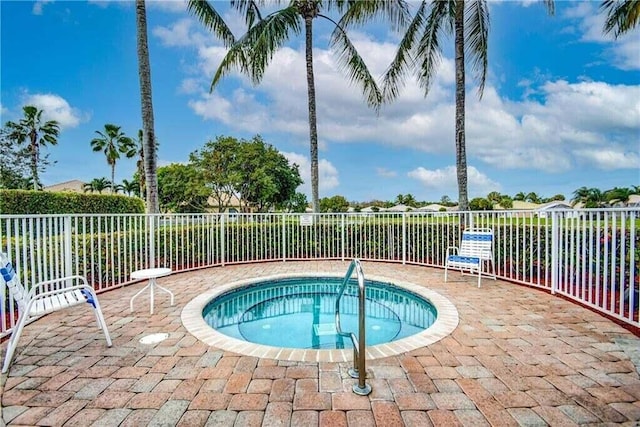 8623 Mangrove Cay, West Palm Beach, FL 33411 - view of pool with fence and a hot tub
