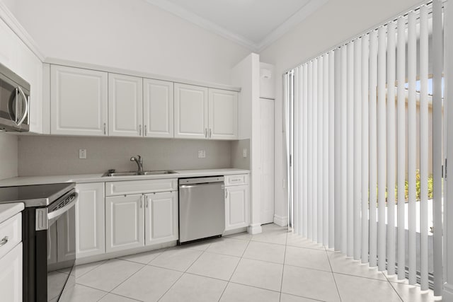 8623 Mangrove Cay, West Palm Beach, FL 33411 - kitchen with appliances with stainless steel finishes, a sink, light countertops, crown molding, and white cabinets