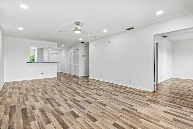 2920 SW 22nd Cir Unit C2, Delray Beach, FL 33445 - unfurnished living room with wood finished floors, a ceiling fan, recessed lighting, and baseboards