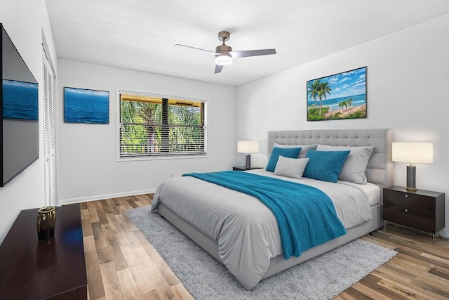 2920 SW 22nd Cir Unit C2, Delray Beach, FL 33445 - bedroom with wood finished floors, a ceiling fan, and baseboards