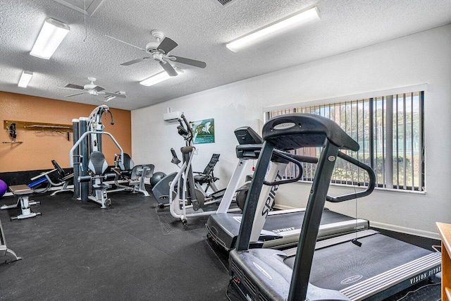 2920 SW 22nd Cir Unit C2, Delray Beach, FL 33445 - gym with a textured ceiling, a wall mounted AC, ceiling fan, and baseboards
